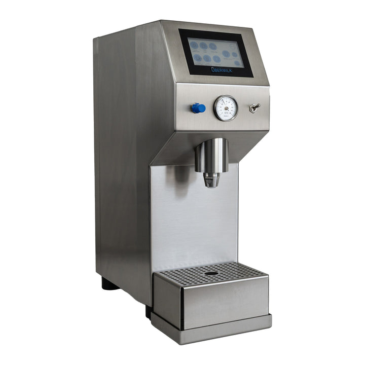 Übermilk ONE Dairy · Hot, three-quarter view showing the touchscreen, pressure gauge and standard high drip tray